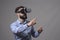Bearded smart casual businessman wearing vr glasses using finger to resize over blank copyspace