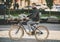 Bearded Smiling Young Man in Glasses Riding Bike.