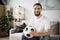 bearded sports fan sitting on couch