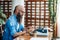 Bearded stylish writer typing on typewriter