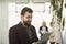 Bearded suit man posing in office workplace