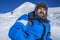 Bearded trekker resting while climbing in winter