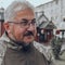 Bearded Ukrainian military man with glasses smiles