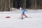 Bearded vintage skier in ski goggles fast during snowfall -Russia Berezniki 11 March 2018 .