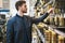 Bearded young man in a hardware store