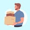 Bearded young man holding parcel boxes