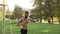 Bearded young muscular athlete doing workout exercises near a football goal. 4K slow mo footage