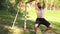 Bearded young muscular man doing pull-up exercisings on a crossbar of football goal. 4K slow mo footage