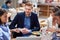 Beardy caucasian with his friends at lunch in restaurant. friends, colleagues, business partners, lunch, break