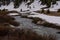 Beartooth River Rushes Along Snowy Bank