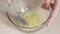Beaten egg whites in a glass bowl