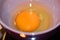 Beaten eggs in bowl with salt