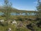 Beatiful camping spot in northern landscape in Swedish Lapland with turquoise blue Vuojatadno river, birch tree forest