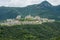 A beatiful castle in the valley and mountains background at Shenzhen Overseas Chinese Town East OCT East in Guangdong, China. A