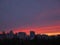 Beatiful colorful sunset sky over high rises in Kyiv city