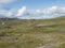 Beatiful northern artic landscape, tundra in Swedish Lapland with blue Duottar lake, green hills and mountains at