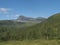 Beatiful northern landscape artic landscape, tundra in Swedish Lapland with green hills and mountains and birch forest