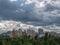 Beatiful urban cityscape with stormy sky over park and high rises in Kyiv city