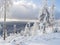 Beatiful winter landscape, view of Cakova vyhlidka viewpoint at fields, forest, villages and snowy spruce tree with snow