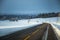 A beatiful winter scenery with a road. Woods in Norway.