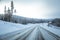 A beatiful winter scenery with a road. Woods in Norway.