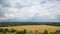 Beatifull wheat and grass field, country summer dark stormy clouds background