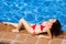 Beaty woman relax near swimming pool