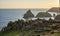 Beauitful sunrise and sunset landscape image of Kynance Cove in Cornwall England with colourful sky