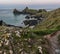 Beauitful sunrise and sunset landscape image of Kynance Cove in Cornwall England with colourful sky