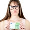 Beauitful woman holding some Euro currency note with funny look