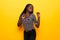 Beauitul african american woman isolated yellow background Dancing happy and cheerful, smiling moving casual and confident