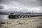 Beaumaris pier,North Wales,Uk.Dramatic sky over coastal town.