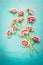 Beauteous pink flowers bunch on shabby chic blue turquoise background, top view