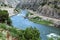 The Beauteous Wind River, Wyoming, Travels through Steep Canyon Walls by a Winding Railroad Track