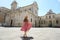 Beautfiul young woman walking in the Cathedral Square of the Baroque City of Lecce, Salento, Italy