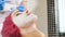 Beautician applying white anti-aging mask on face. Beauty concept. Young woman in her thirties in spa centre getting