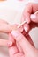 Beautician cleaning cuticles hands with cosmetic stick. Beauty spa salon