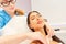 Beautician cleans a woman`s skin on the cleavage
