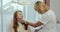 Beautician consults woman about facial botox injection in the beauty salon closeup.