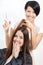 Beautician cuts hair of woman in hairdresser\'s