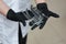 beautician doctor in black gloves holds darsonval tips
