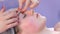 Beautician doctor making myoplastic facial massage to woman in beauty clinic.