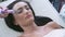 Beautician doing stimulating facial massage with hardware procedure