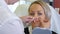 Beautician draw correction lines on woman face