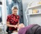 Beautician Giving Face Massage To Woman In Parlor