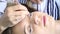 Beautician increases eyelashes for beautiful girl. Eyelash extension procedure