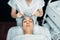 Beautician makes face rejuvenation procedure