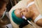 Beautician massages the face with microcurrents