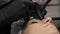 Beautician, specialist of permanent make-up making eyeliner permanent make up