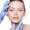 Beautician touch and exam health woman face